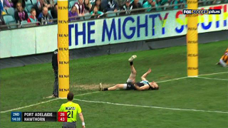 Aussie Rules Football Player Scores Goal, Falls Down In Same Motion